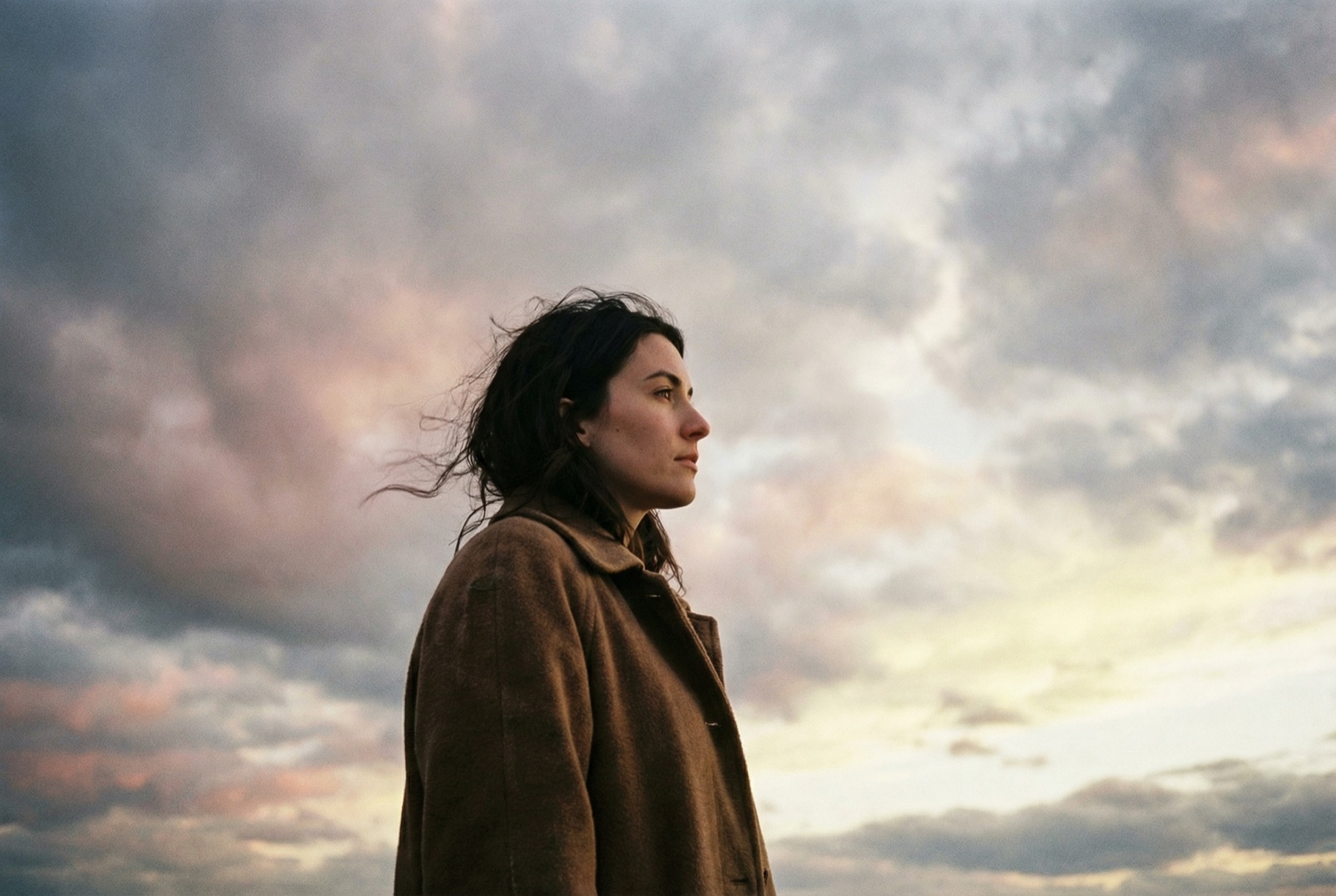 Person looking ahead toward the sky